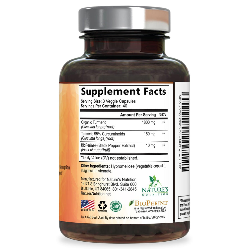 Nature's Nutrition Turmeric Curcumin capsules pictured with a glass of water.