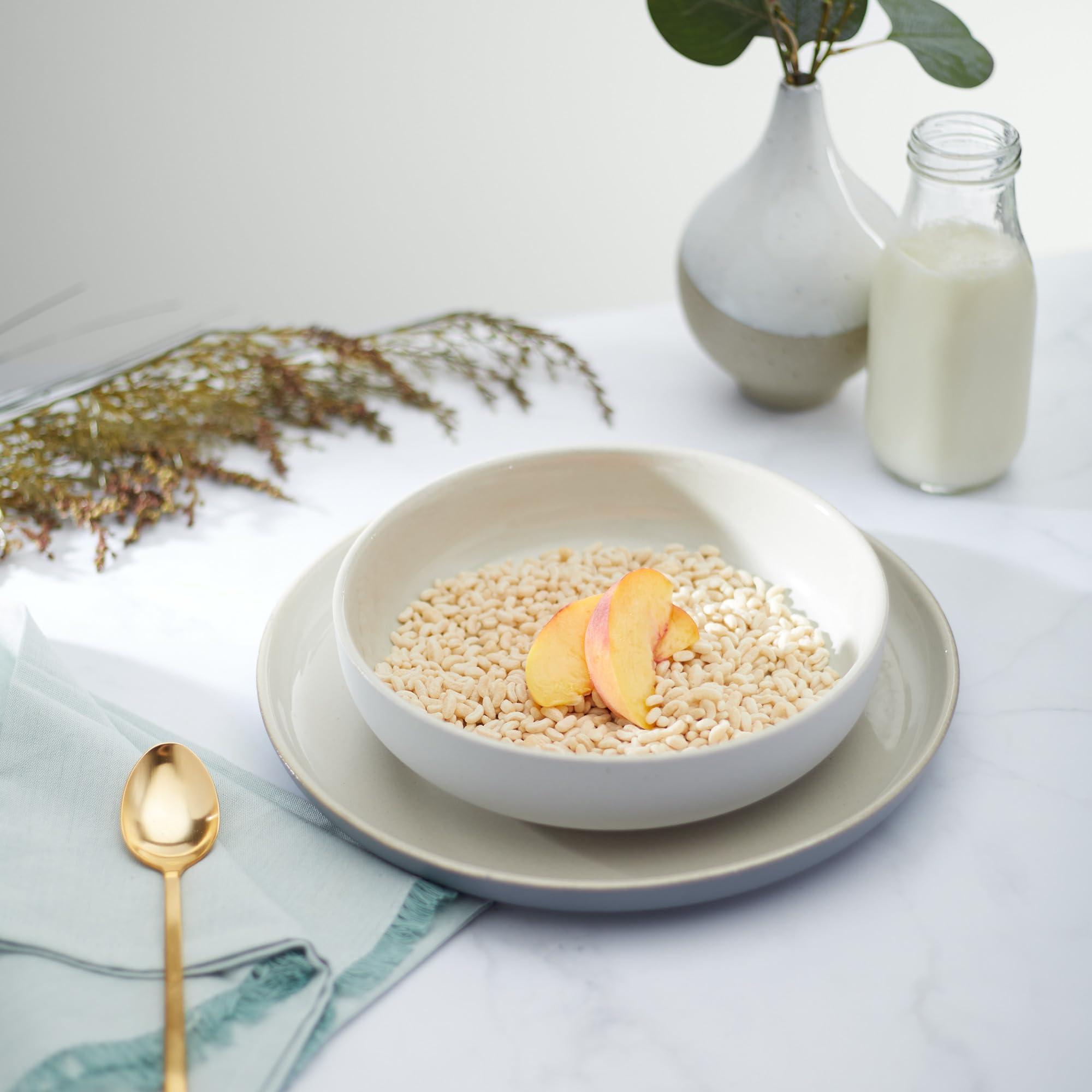 Nature's Path Crispy Rice Cereal spoonful illustrating crunch in a bowl.