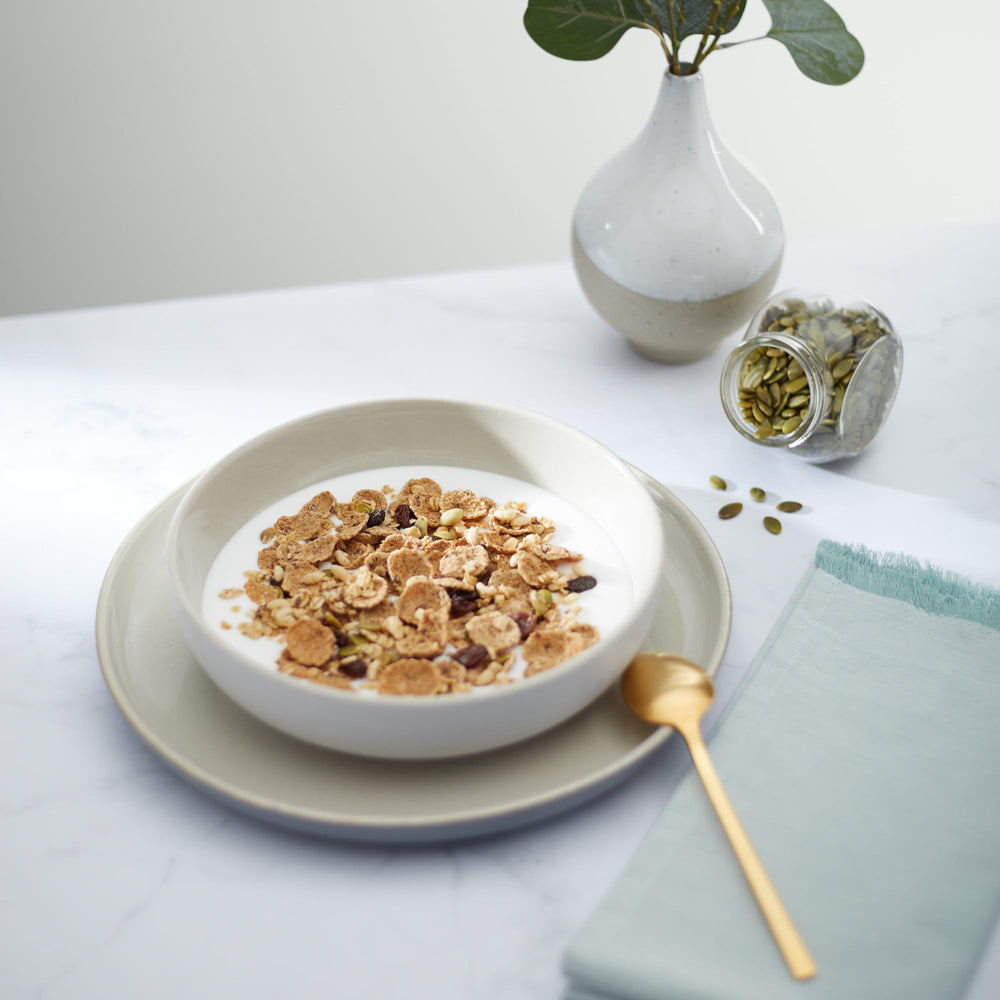 Nature's Path Flax Plus Pumpkin Raisin Crunch packaging emphasizes organic, Non-GMO ingredients.