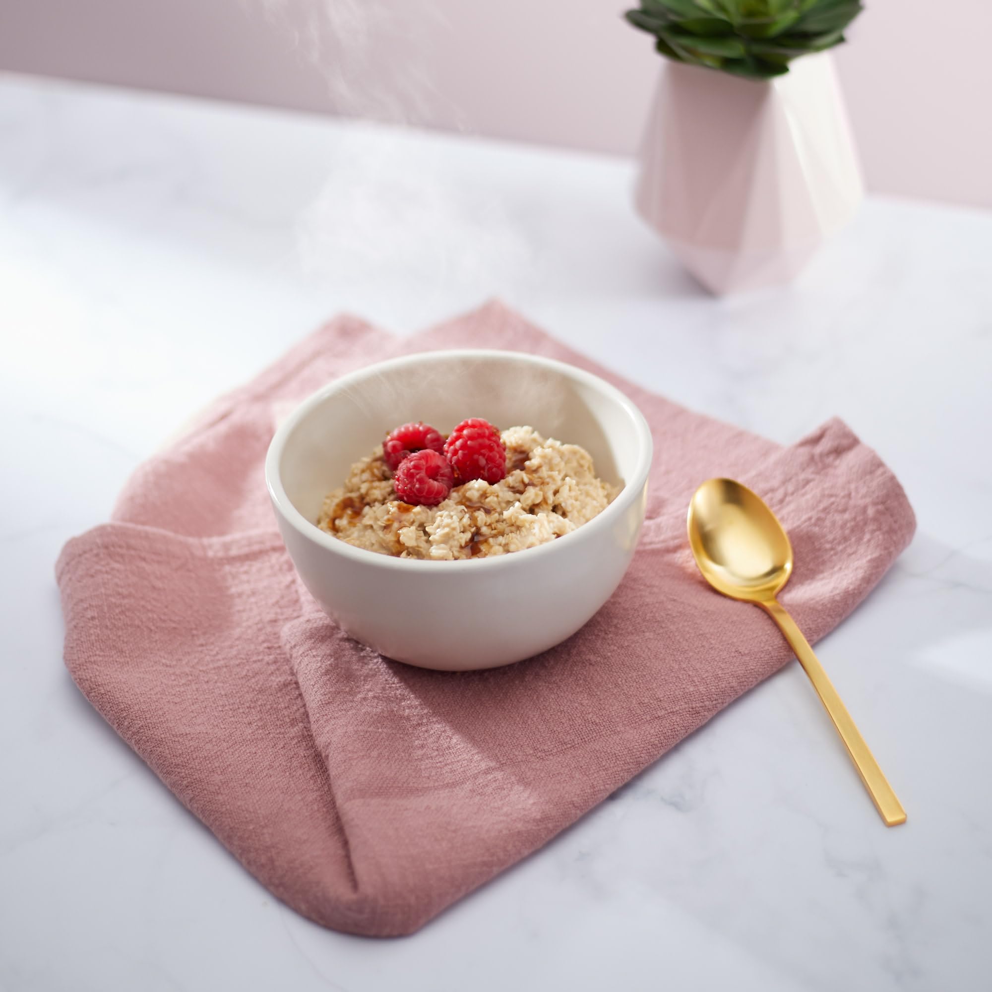 Steaming bowl of Nature's Path brown sugar maple oats invites a comforting morning.