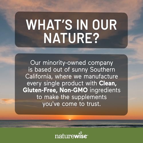 Two NatureWise capsules with a glass of water beside the bottle.