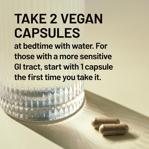 NatureWise Total Colon Care bottle being poured for easy dosing.