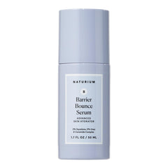 Naturium Barrier Bounce Serum bottle on a clean vanity showing daily hydration and dewy glow.