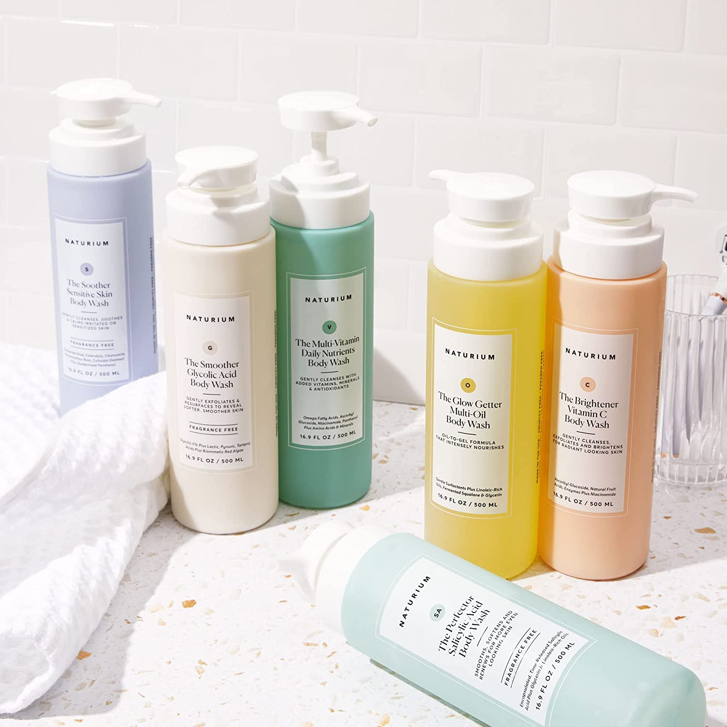 Naturium bottle on tile display suggests an at-home spa routine