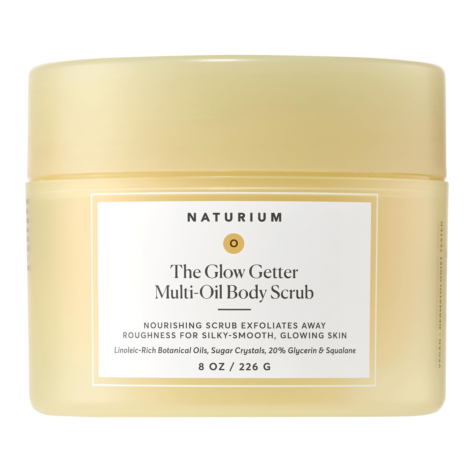 Naturium Glow Getter Body Scrub jar close-up showing exfoliating sugar crystals for radiant skin
