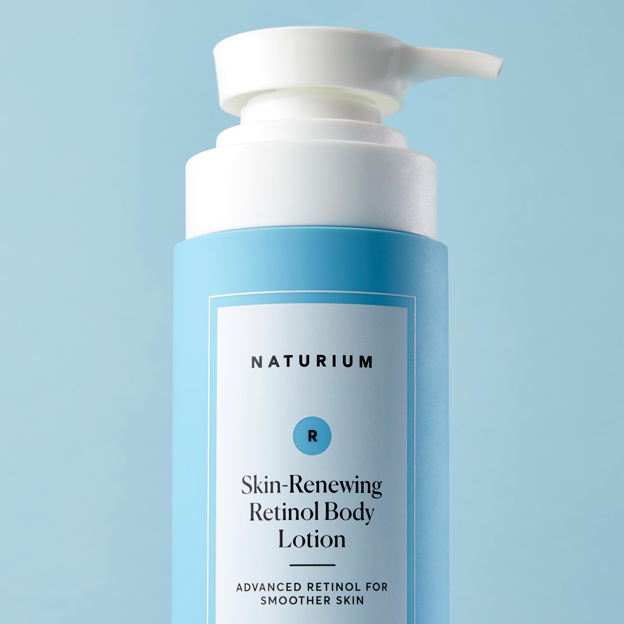 Naturium retinol lotion on skin with even tone and reduced redness concept.