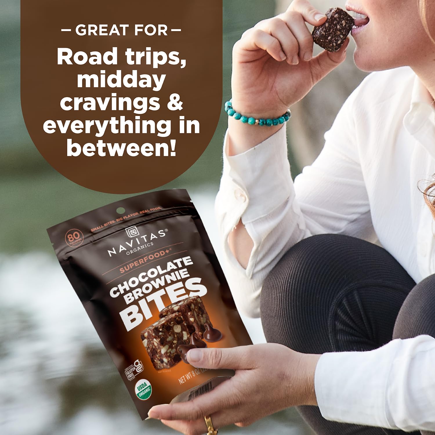 Navitas Organics Chocolate Brownie Bites on a desk for a quick energy break