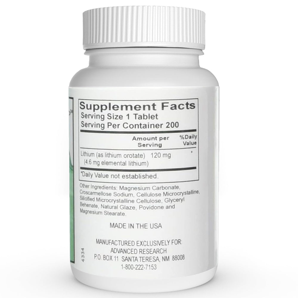 NCI Advanced Research bottle beside a glass of water for daily routine.