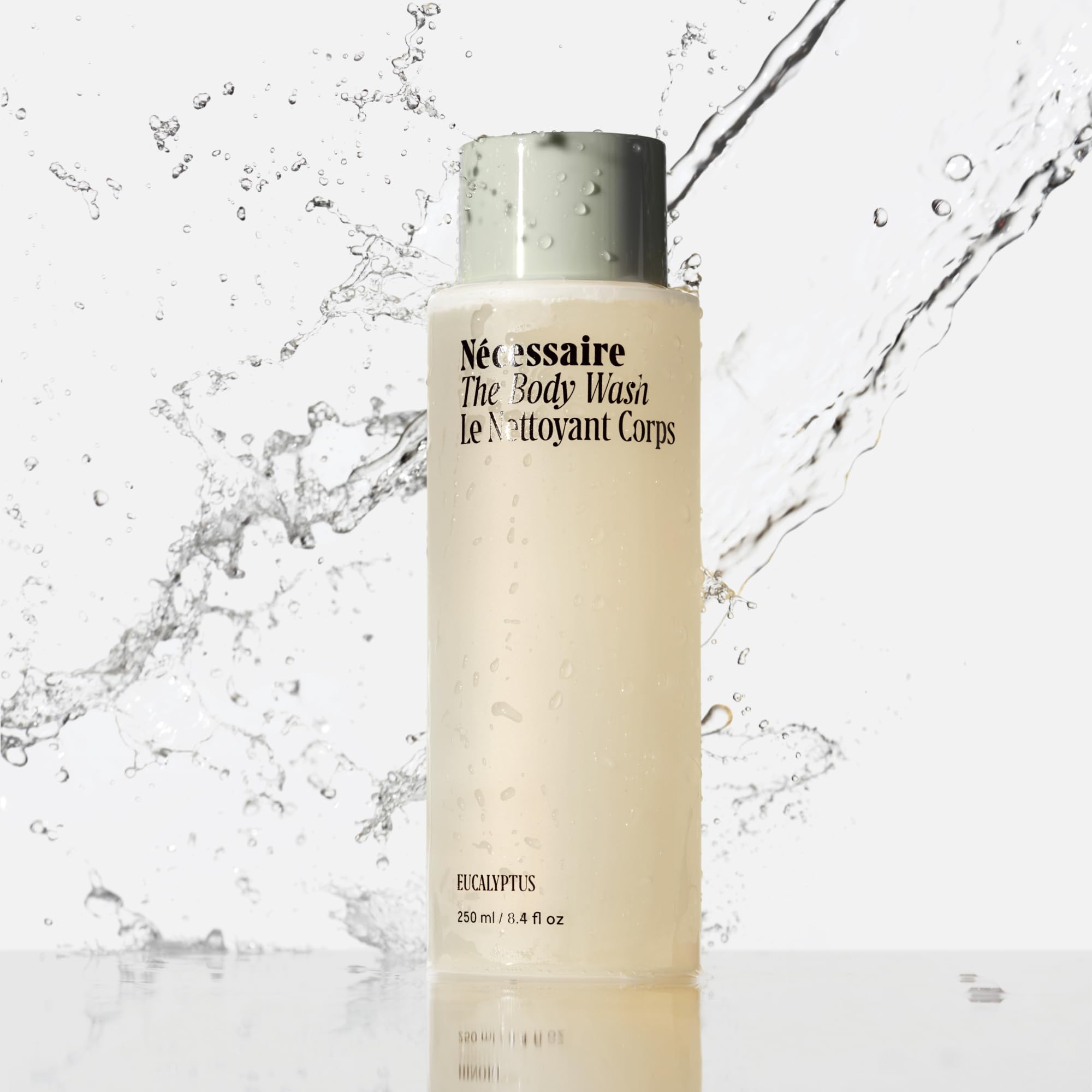 Nécessaire Eucalyptus bottle being poured, illustrating a mild cleansing lather.