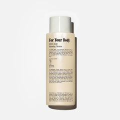 Rich foam from Nécessaire Hinoki Body Wash creating a soothing shower