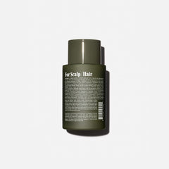 Nécessaire Rosemary Shampoo bottle pour shows distribution of lather for soft, clean hair.