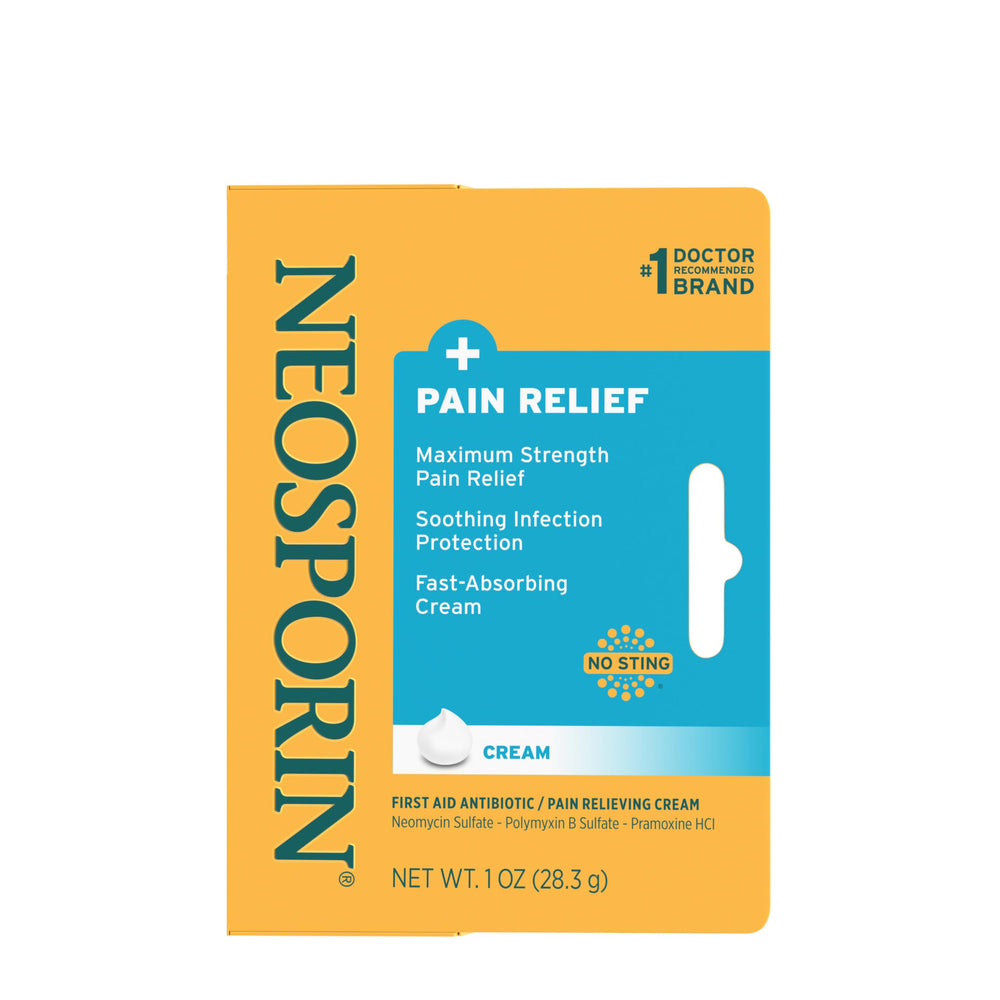 Neosporin Dual Action Cream compact tube beside purse for quick on-the-go care