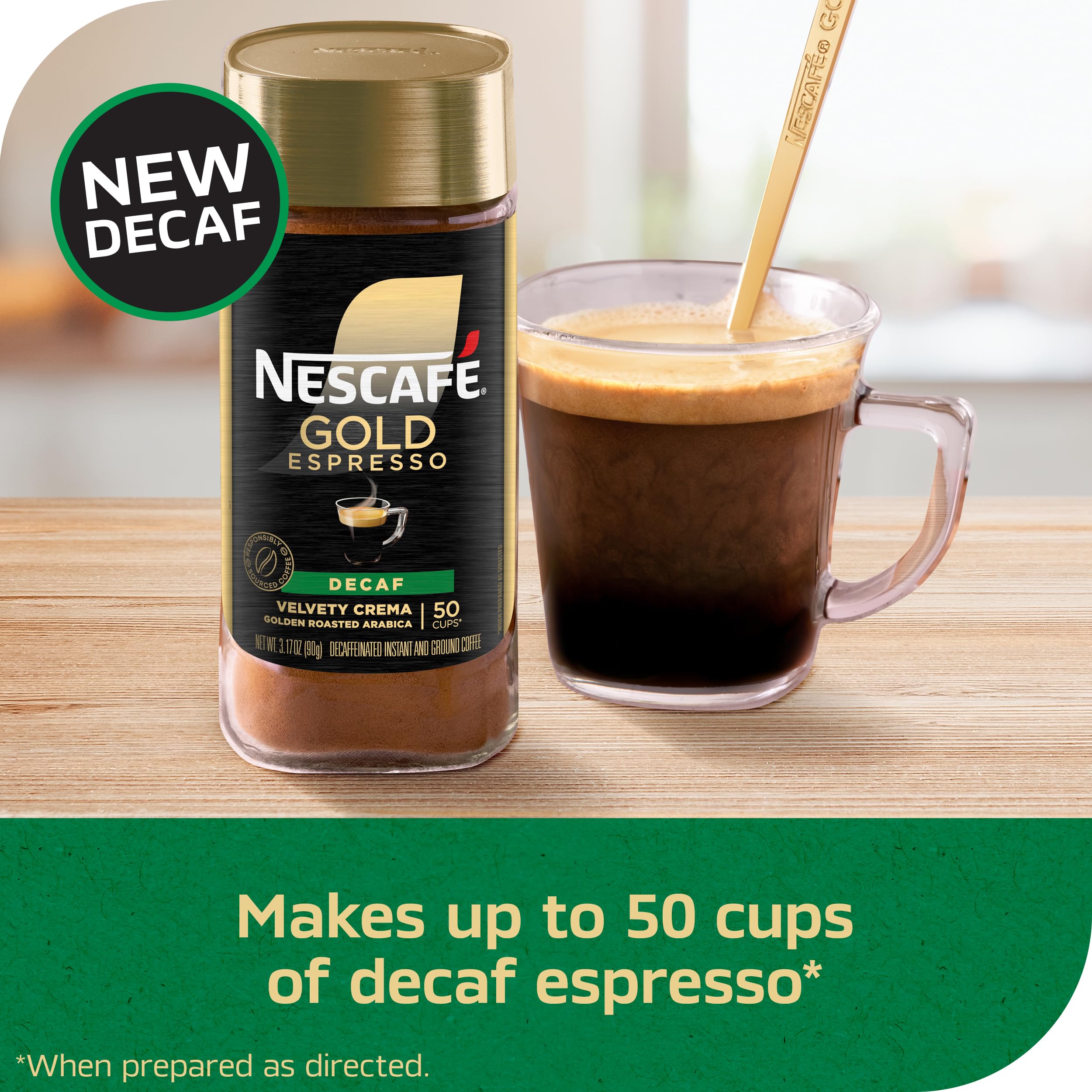 NESCAFÉ Gold Decaf Espresso crema on top in a steaming cup.