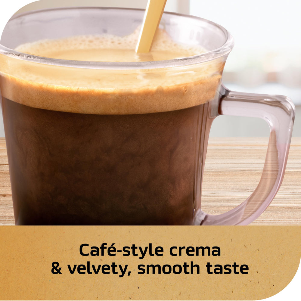 NESCAFÉ Gold Espresso Blonde dissolving instant coffee into water to create a smooth espresso base.