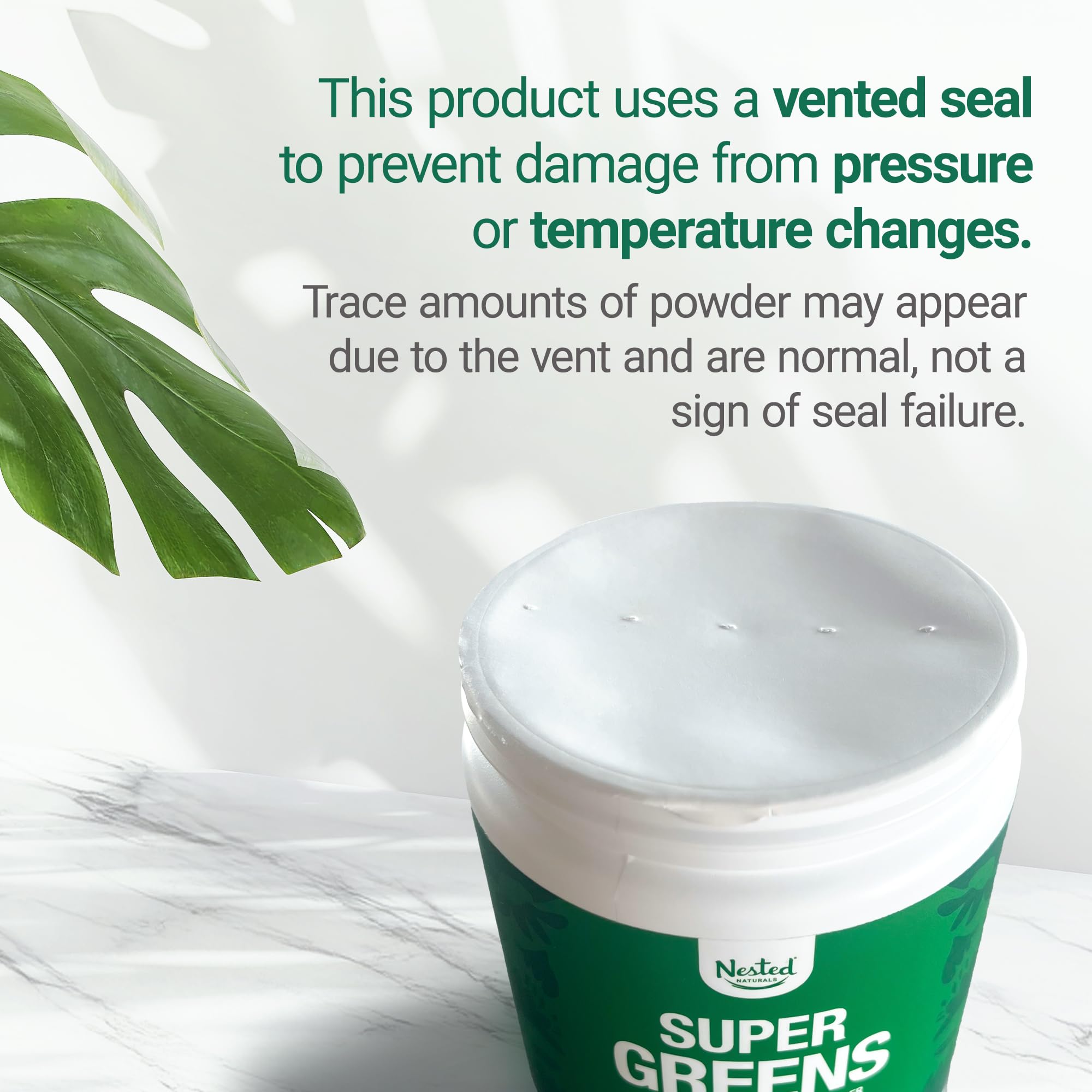 Nested Naturals Super Greens being stirred into a glass of water.