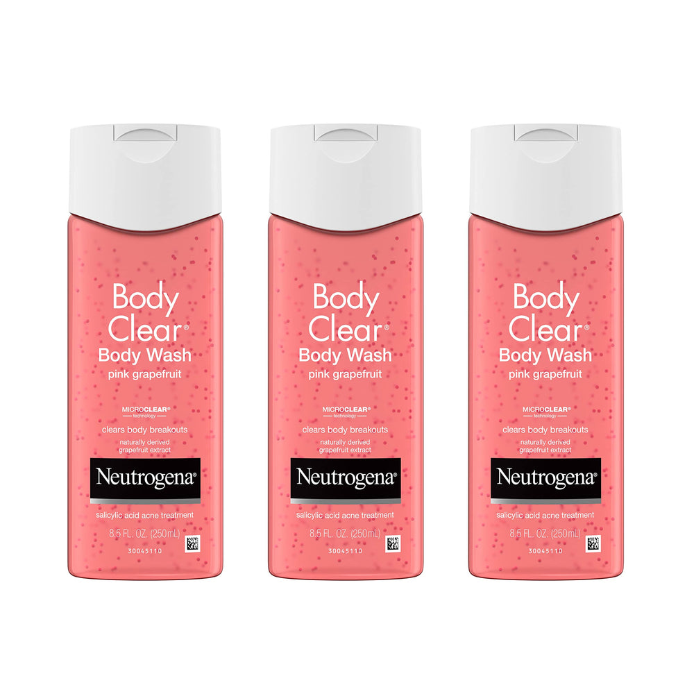 Neutrogena Body Clear pink grapefruit bottle on a bathroom shelf for daily acne care.