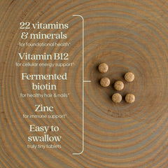 New Chapter Tiny Tabs tablets in hand illustrating portable daily supplement on the go