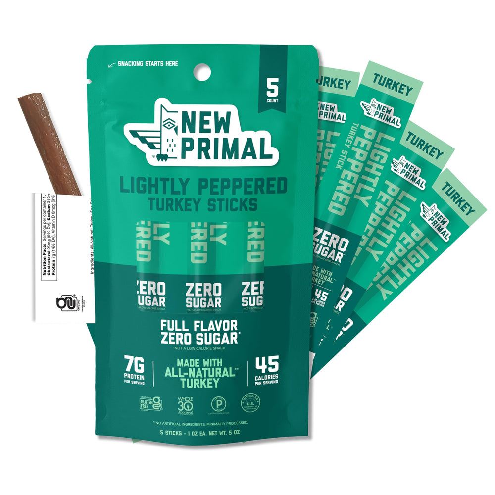 The New Primal Lightly Peppered Turkey Sticks pack front, convenient on-the-go snack.