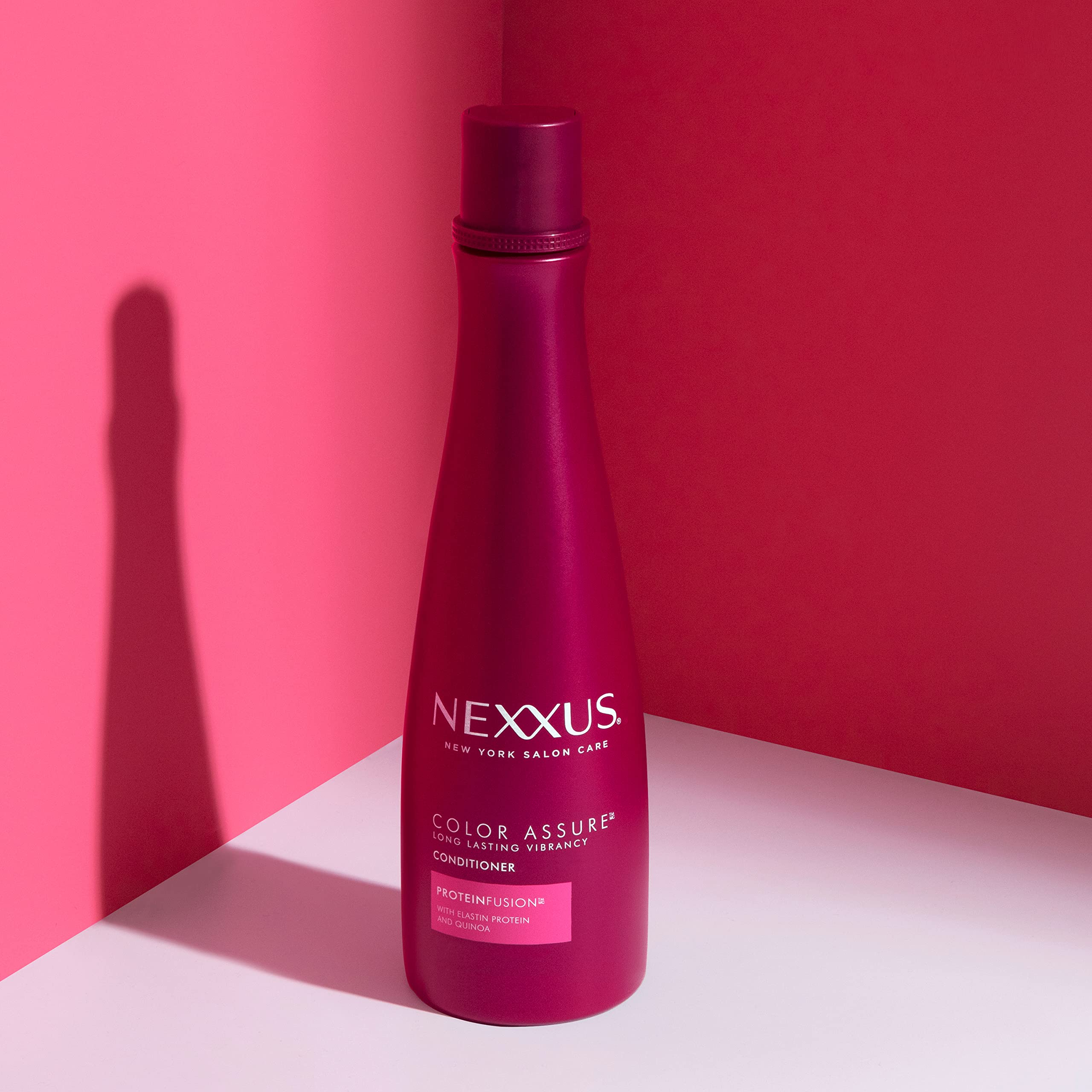 Nexxus Color Assure protein blend illustration featuring elastin and quinoa for stronger hair.
