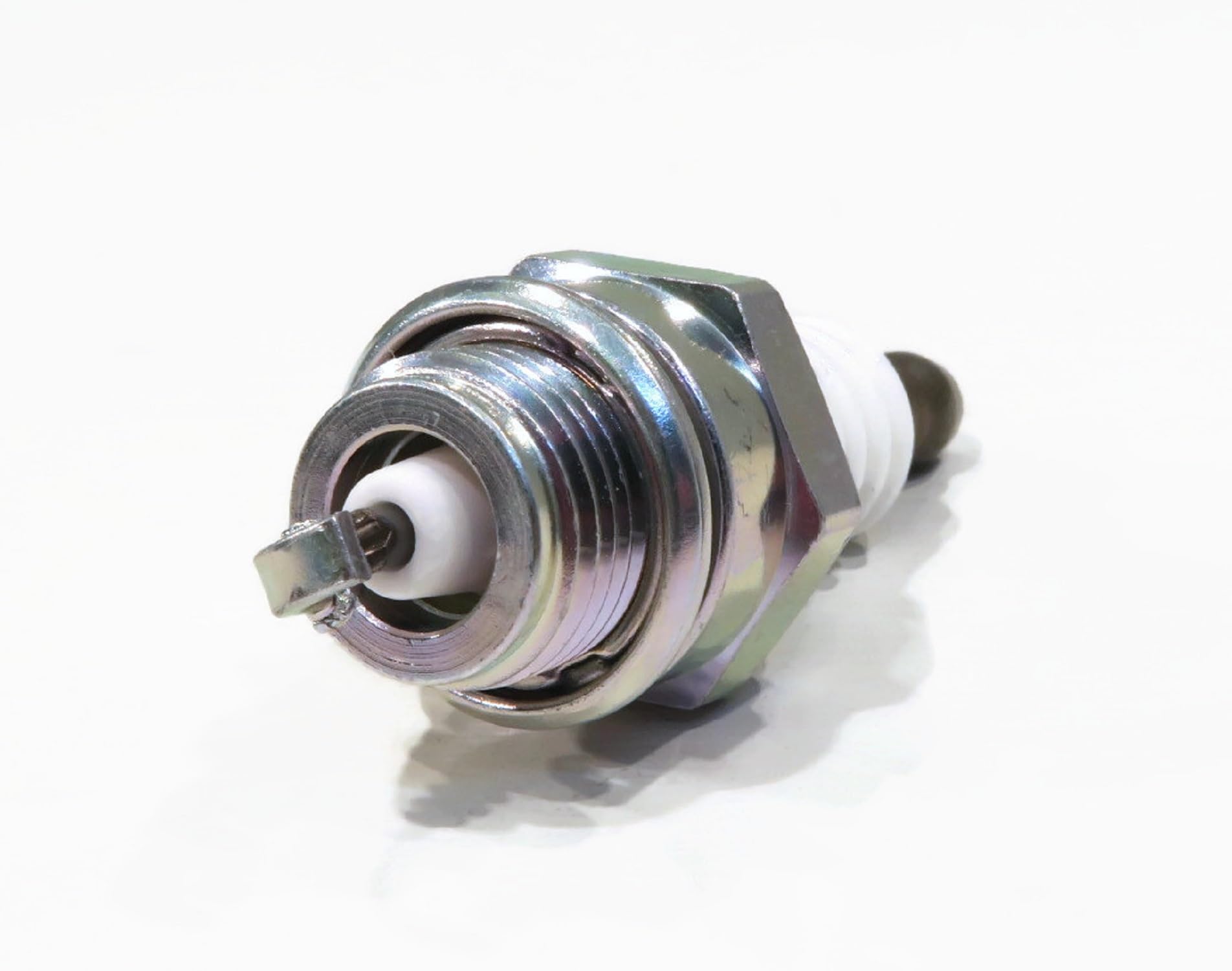 NGK spark plugs installed in engine bay for direct replacement fit