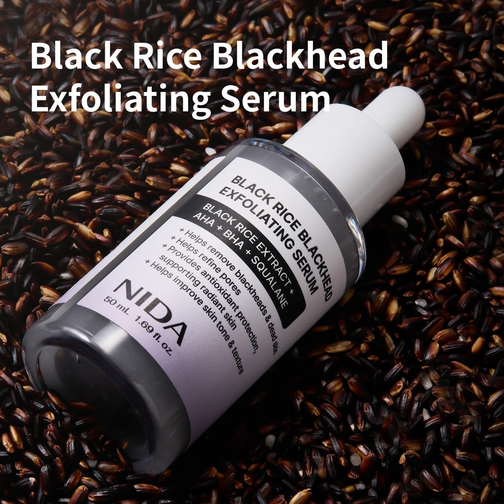 NIDA Black Rice Serum texture closeup shows fine particles for pore refinement.