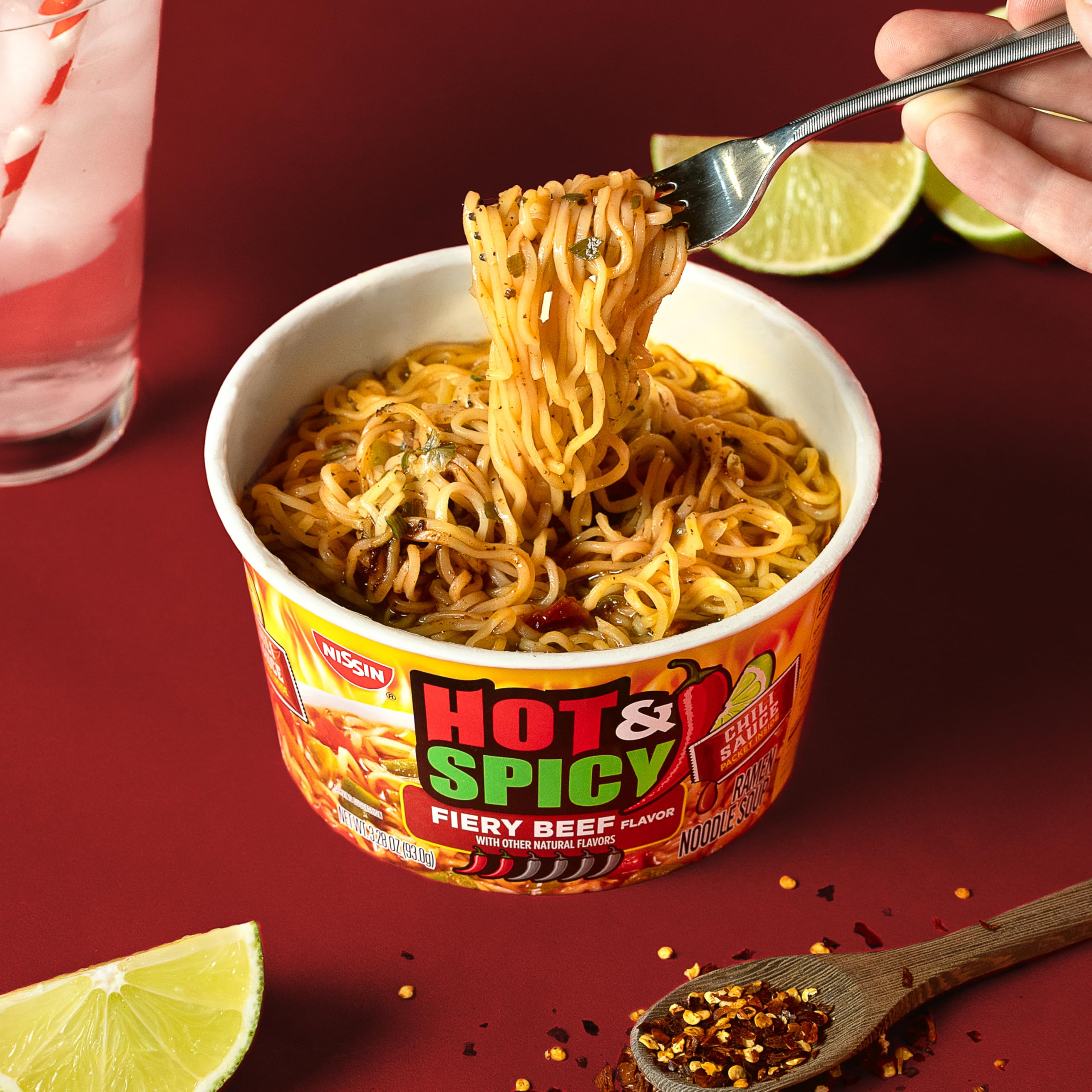 Nissin Hot and Spicy ramen noodles in broth with visible steam.