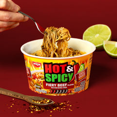 Nissin Hot and Spicy ramen packaging and noodles ready to serve.