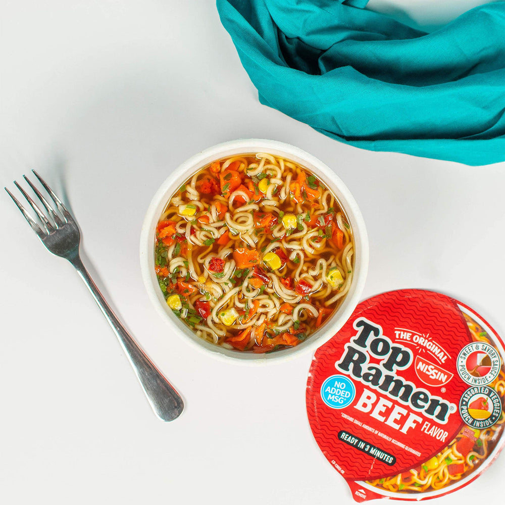Nissin Top Ramen Beef serving in a bowl with chopsticks.