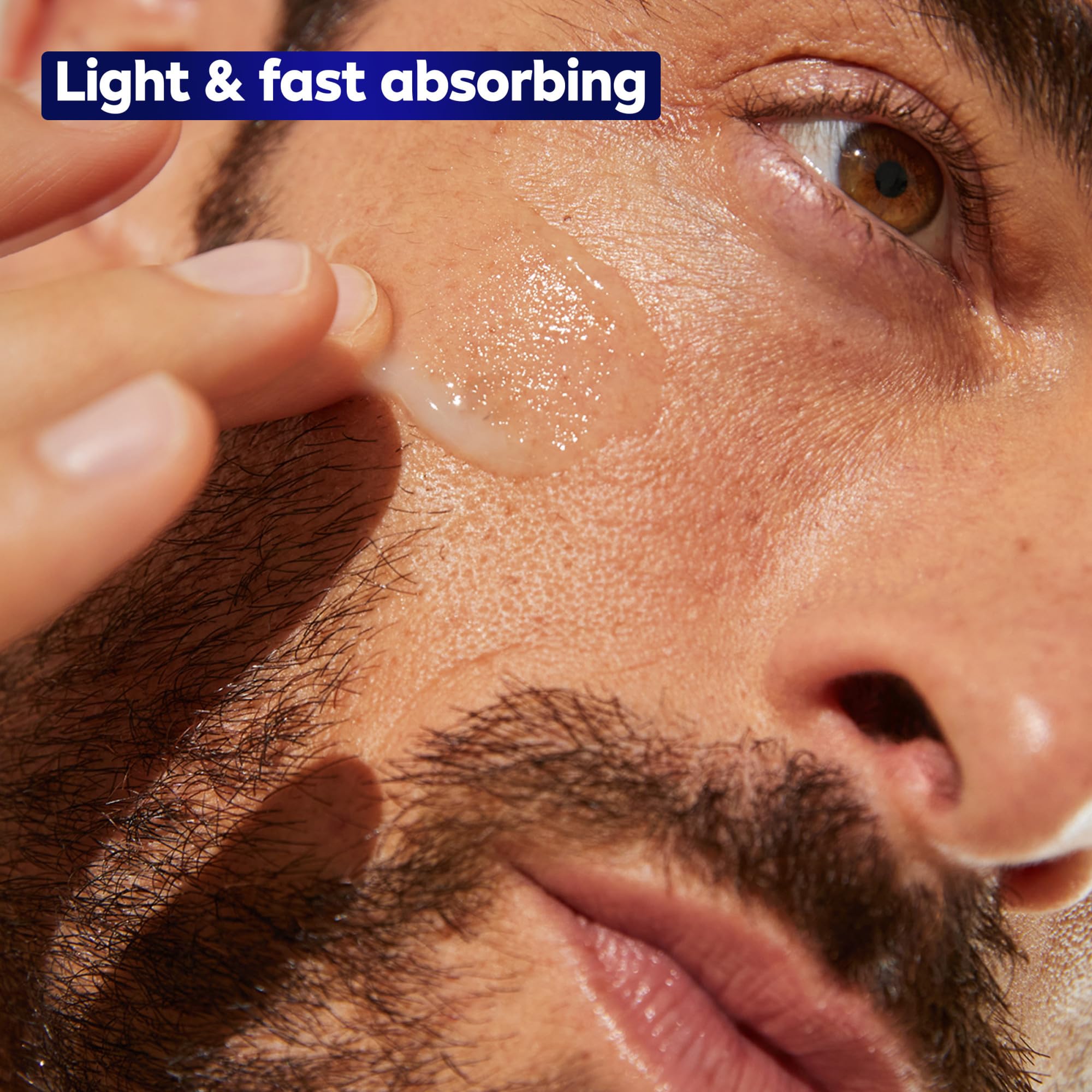 Man applying the serum on clean face.