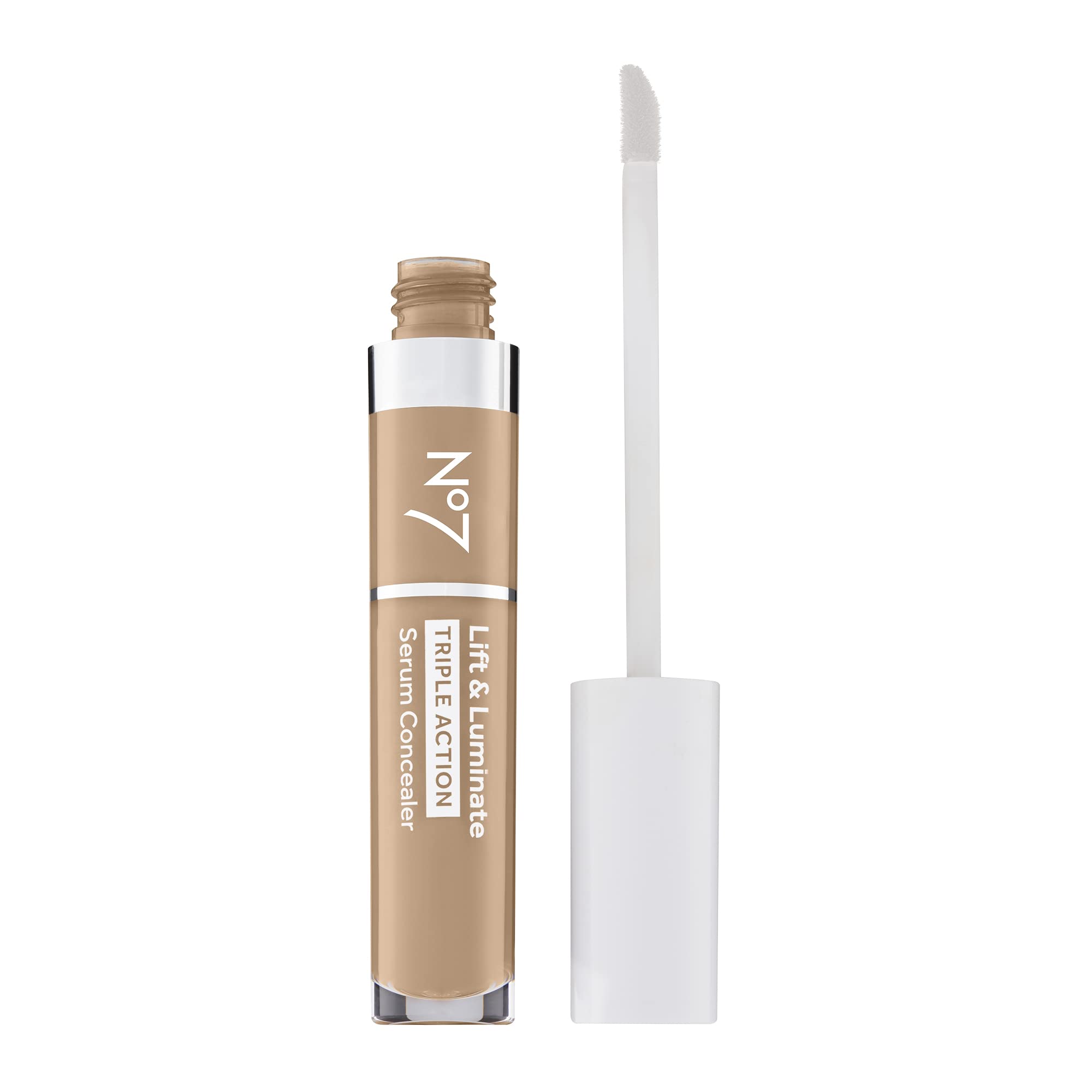 Close-up of concealer applicator applying under-eye for dark circles.