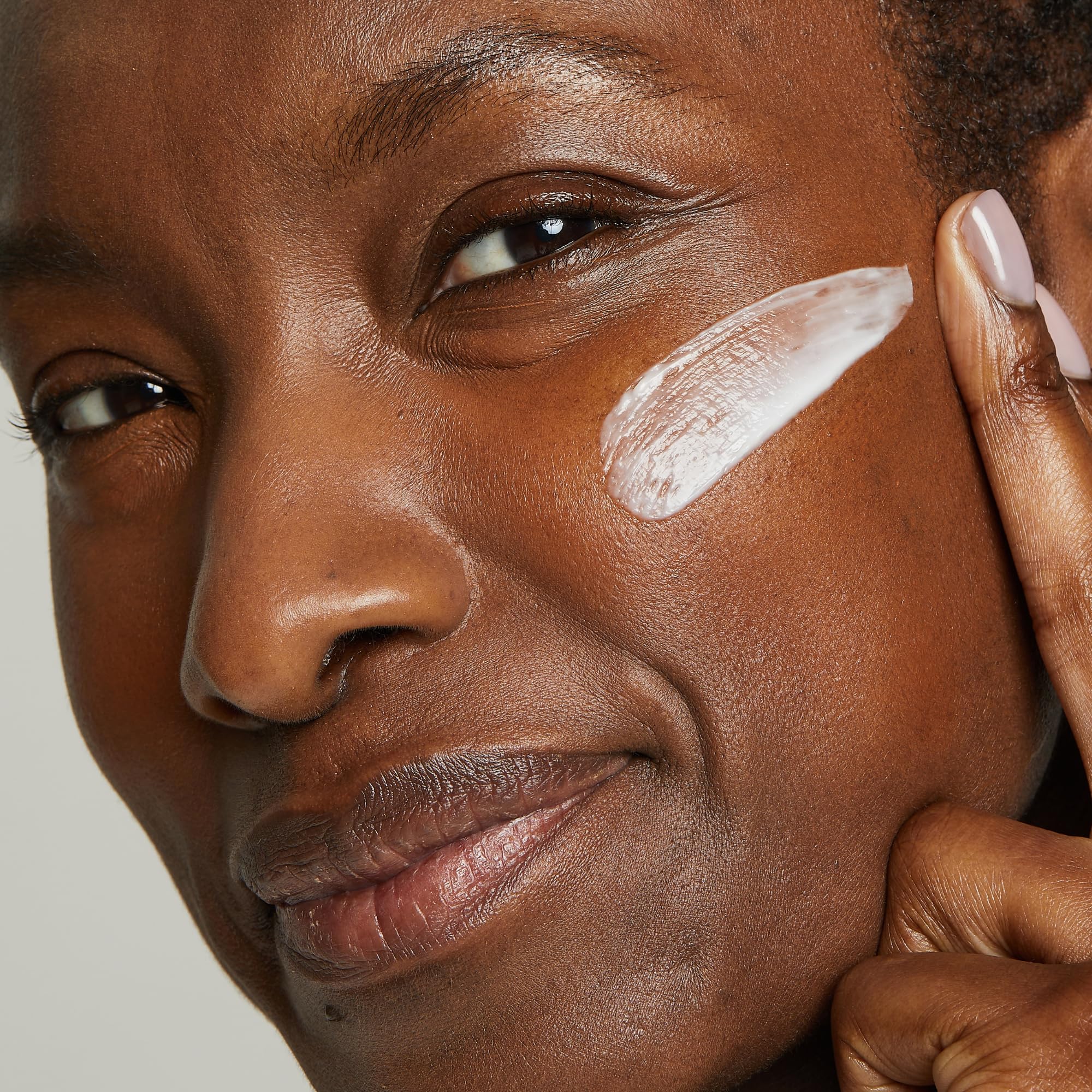 Night cream on hand ready for nightly hydration and renewal