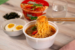 Nongshim Kimchi Bowl ingredients with vegetables and sauce pack