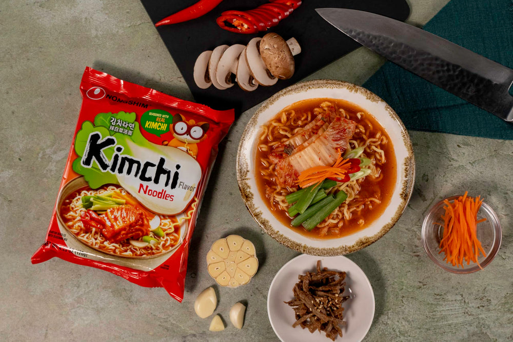 Nongshim Kimchi Ramen kimchi-flakes close-up emphasizes tangy aroma and crunch