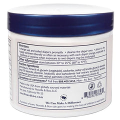 Applying Noodle & Boo diaper rash ointment to a baby's diaper area.