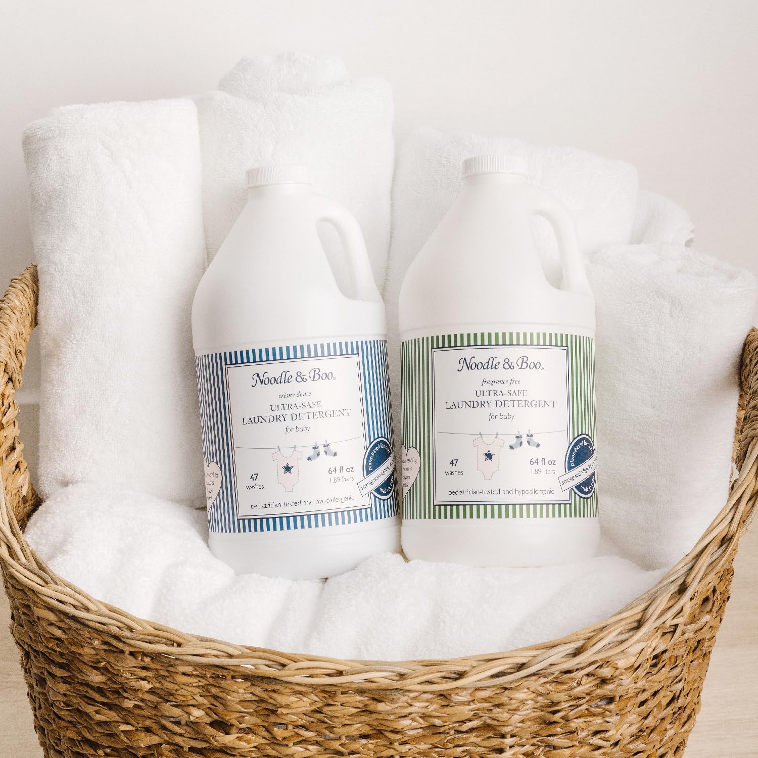 Noodle & Boo in-wash shot demonstrates effective stain lifting on baby clothes.