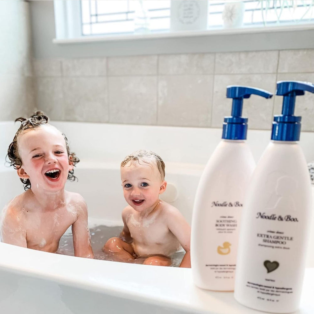 Noodle & Boo soothing baby body wash lather demonstrates mild daily care for newborns.