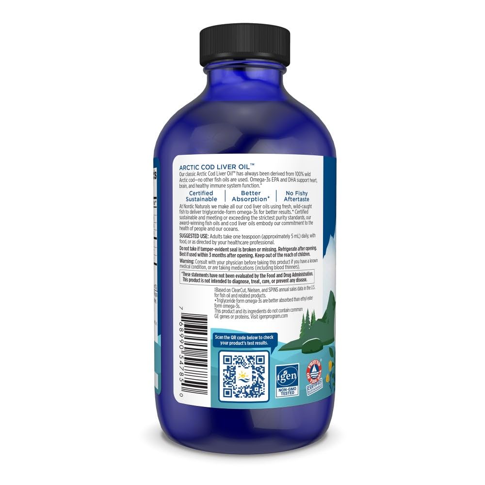 Nordic Naturals Arctic Cod Liver Oil orange bottle with glass for serving.