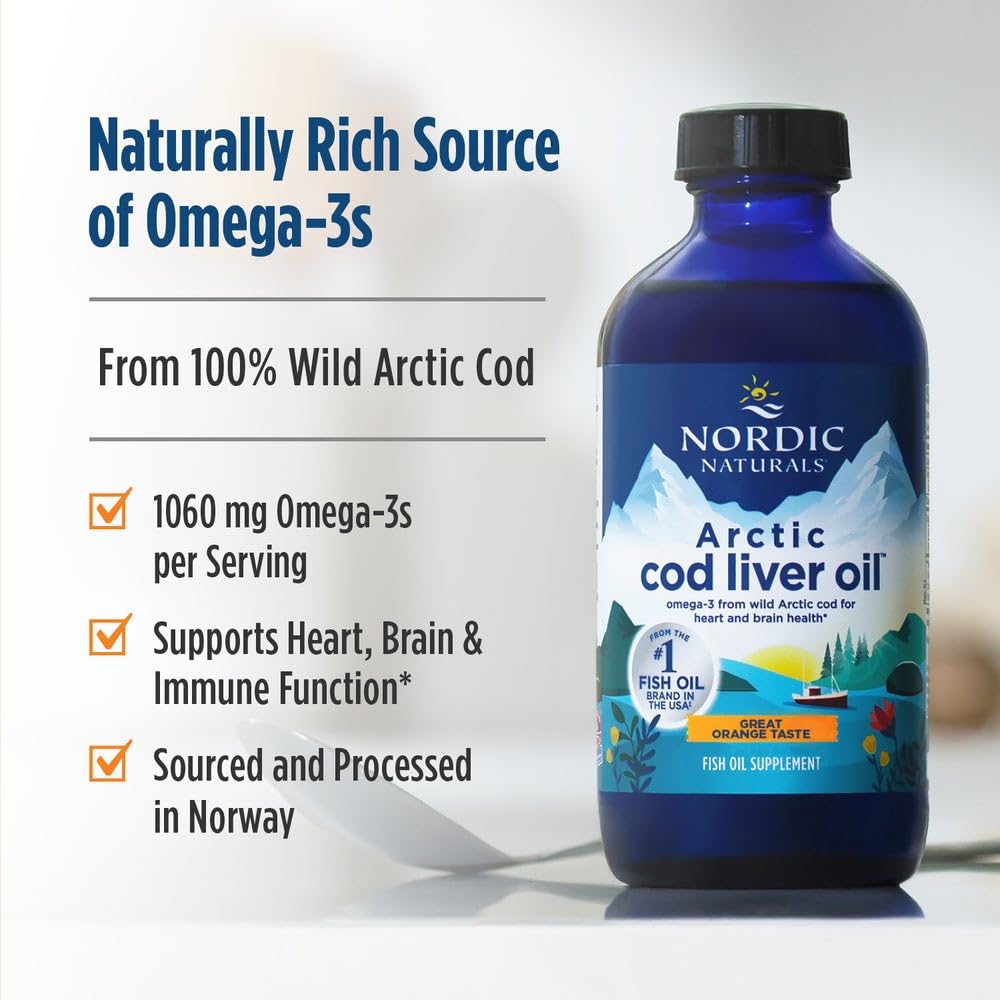 Pouring Arctic Cod Liver Oil into a glass for easy daily use.