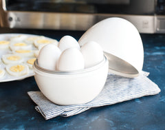 Nordic Ware Microwave Egg Boiler inside tray with eggs ready to steam softly.