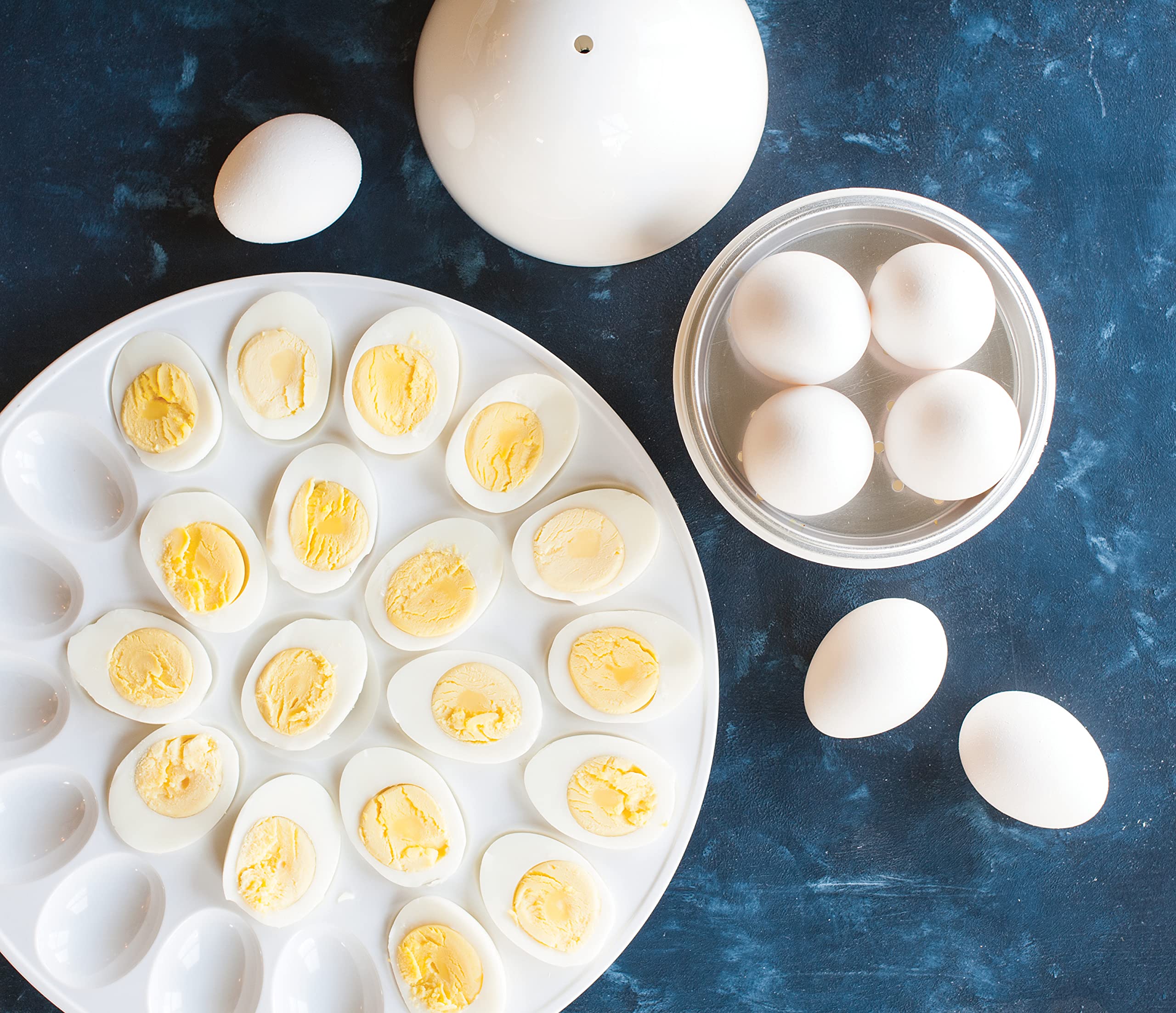 Nordic Ware Microwave Egg Boiler perforated shelf evenly circulates steam for even doneness.