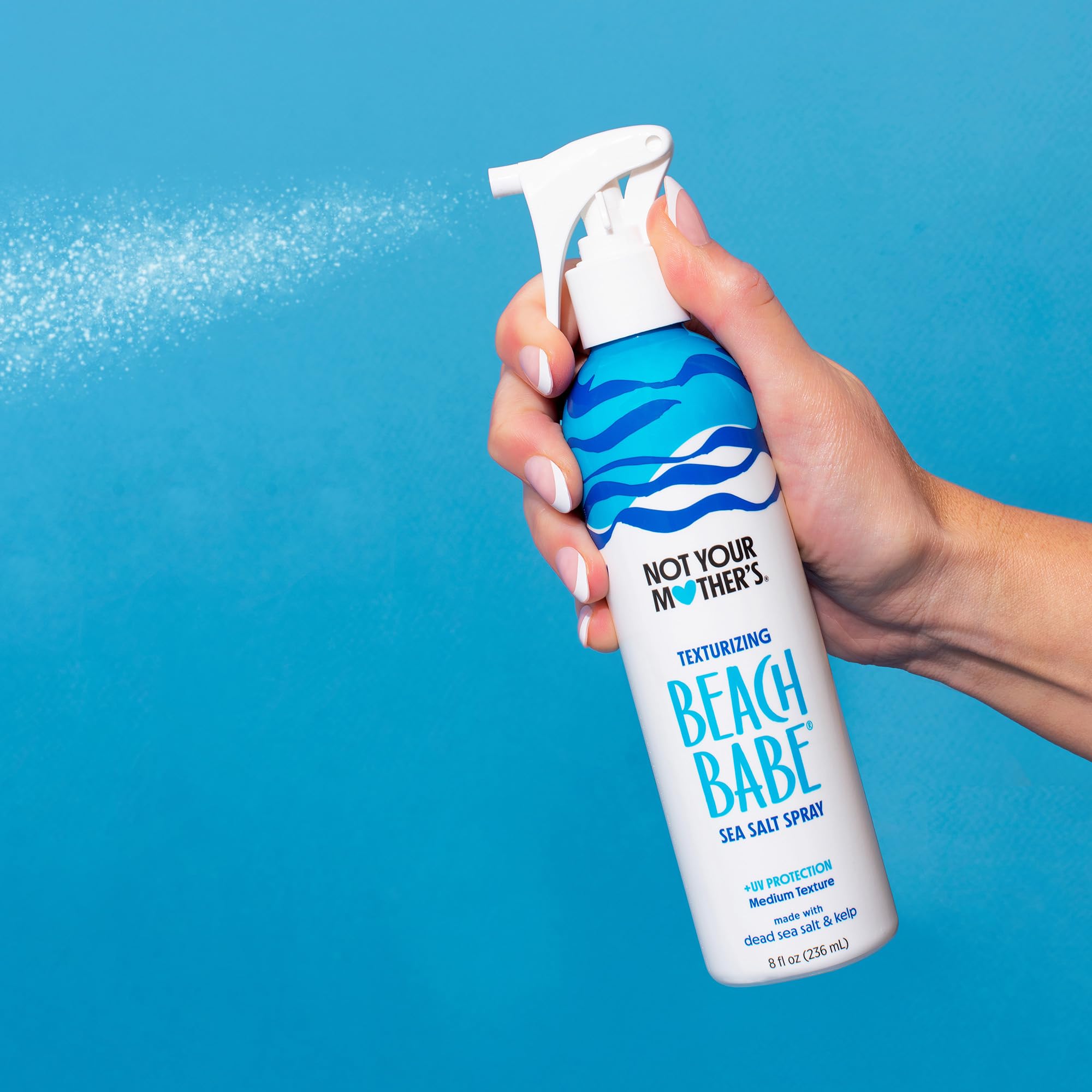 Not Your Mother's Beach Babe Sea Salt Spray on model with matte finish hair.