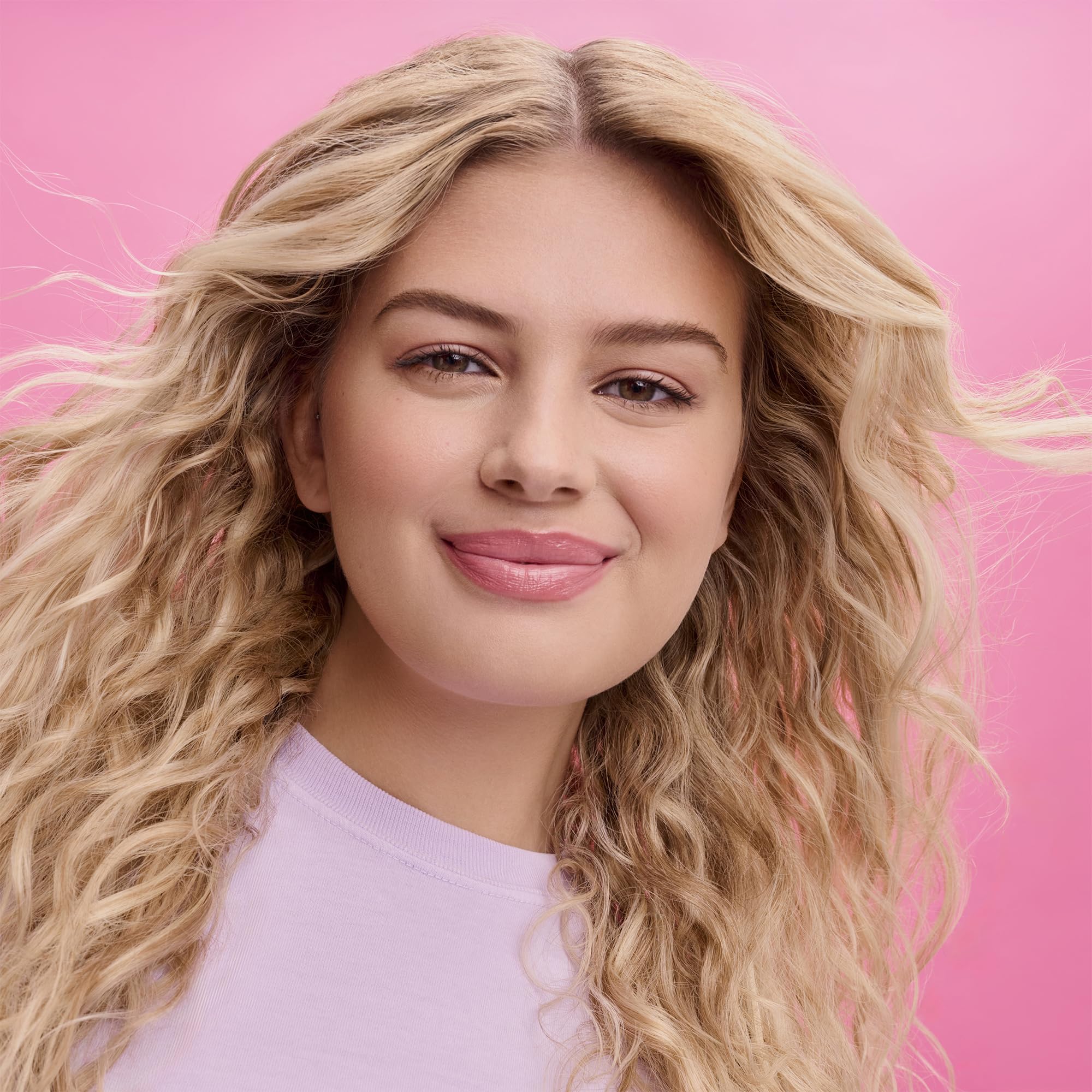 Not Your Mother's Beach Babe Sea Salt Spray refreshing dry hair with texture.