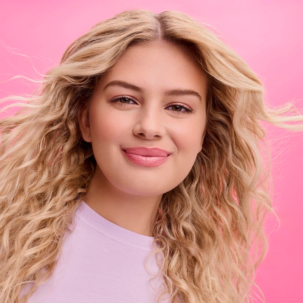 Not Your Mother's Beach Babe Sea Salt Spray refreshing dry hair with texture.