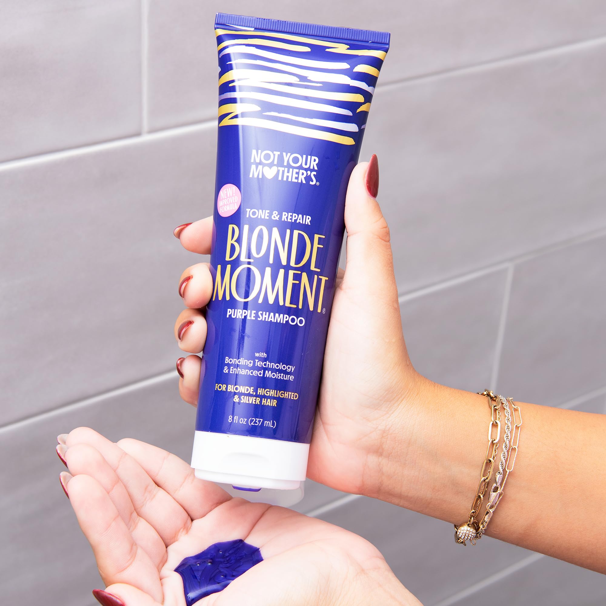 Not Your Mother's Blonde Moment Purple Conditioner bottle promoting color retention on lightened hair.