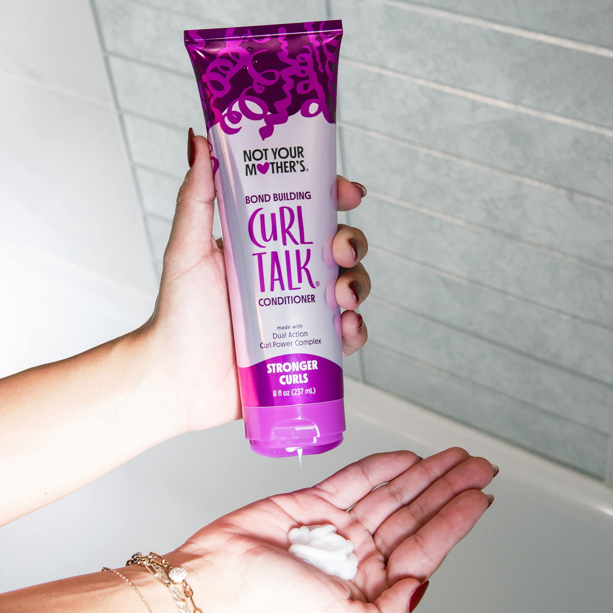 Not Your Mother's Curl Talk Bond Building Conditioner label close-up shows color-treated hair compatibility.