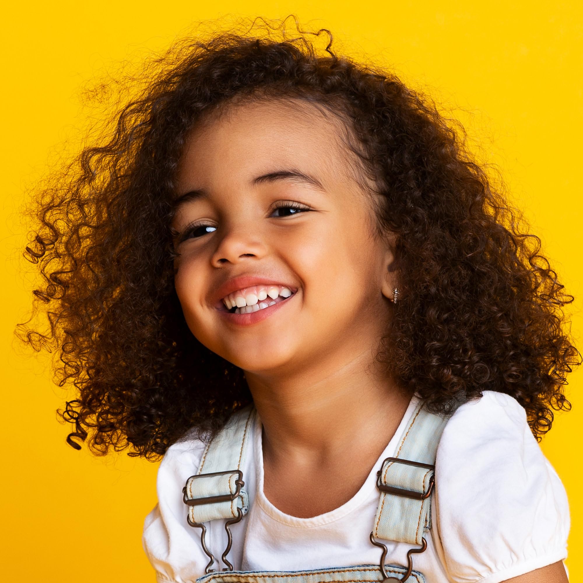 Not Your Mother's Kids Curly Care detangler spray detangles curls for easier mornings.