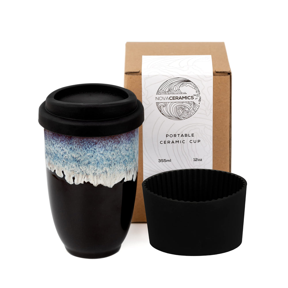 Nova Ceramics Monsoon mug with blue running glaze on black base, a unique travel tumbler