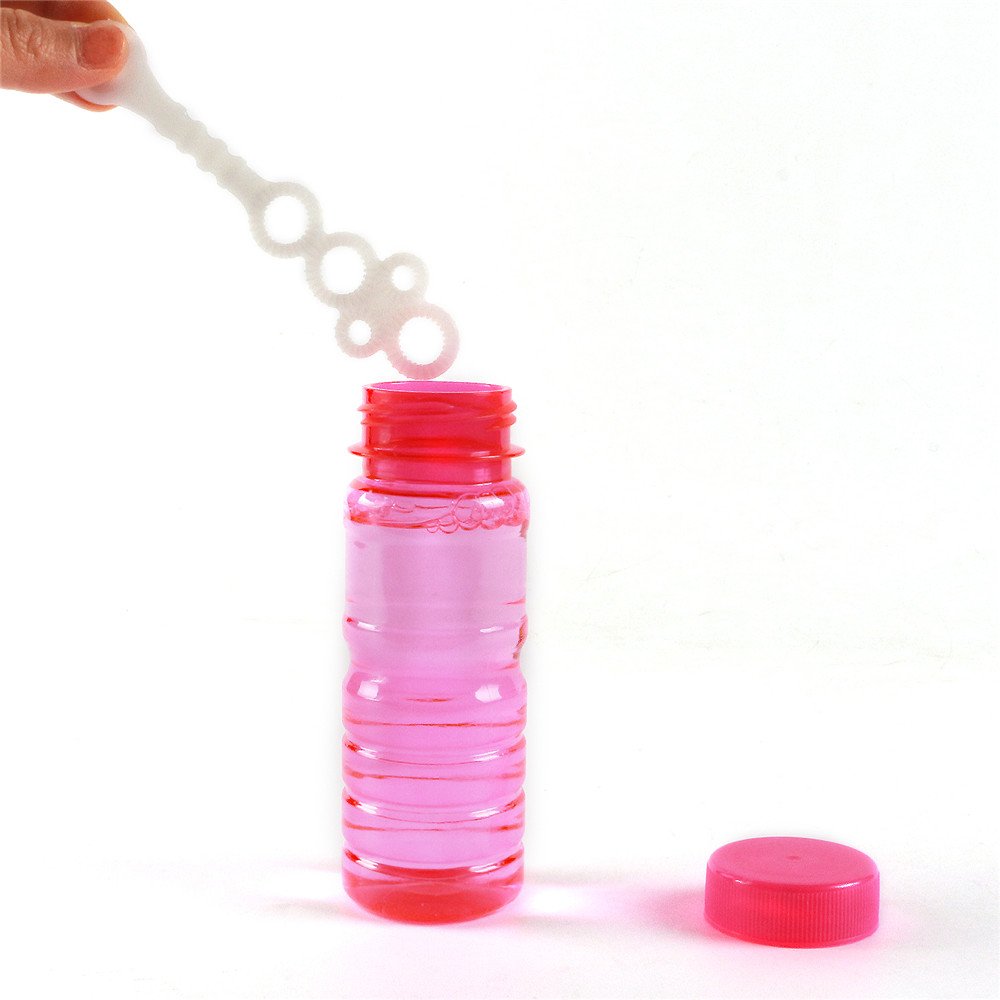 Novelinks kids enjoy bubbles during outdoor play with safe wands.