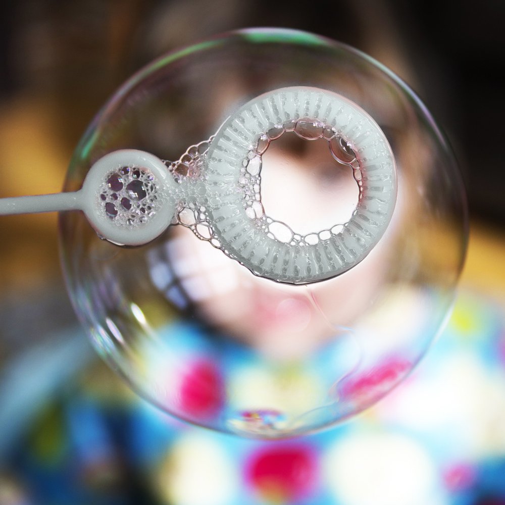 Novelinks sunlit bubbles colors shimmer as children chase colorful spheres.