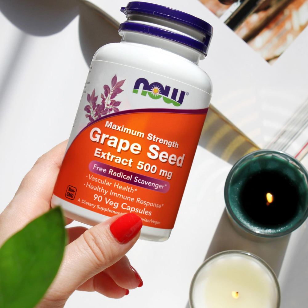 NOW Foods Grape Seed Extract capsules on white background for daily supplementation
